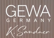 GEWA Germany logo with K. Sandner signature on a wood-textured background